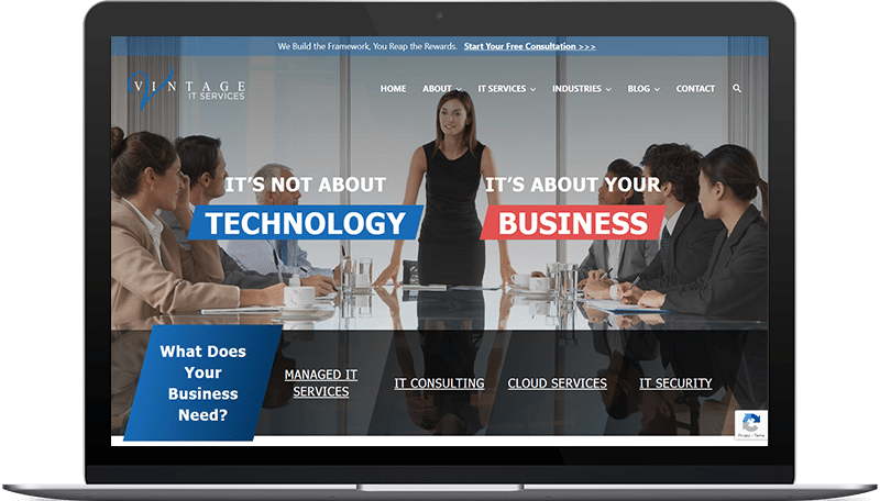 Vintage IT Services website design on a laptop screen.